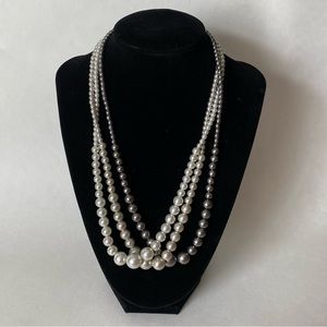Three strand faux metallic pearl graduated bead necklace